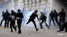 Hollande amenaza con prohibir las protestas tras graves disturbios