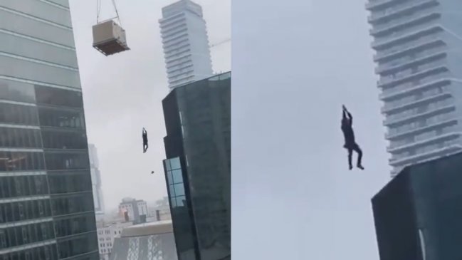 Hombre quedó colgado de una grúa a varios metros del piso en un edificio en construcción