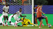 Escocia se adelantó a Haití en el Mundial con un tiro de McGinn que rebotó en Bellegarde