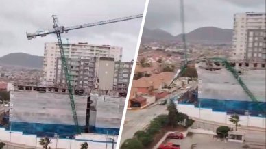 Impactante: Grúa de construcción cedió por el intenso viento y cayó sobre viviendas